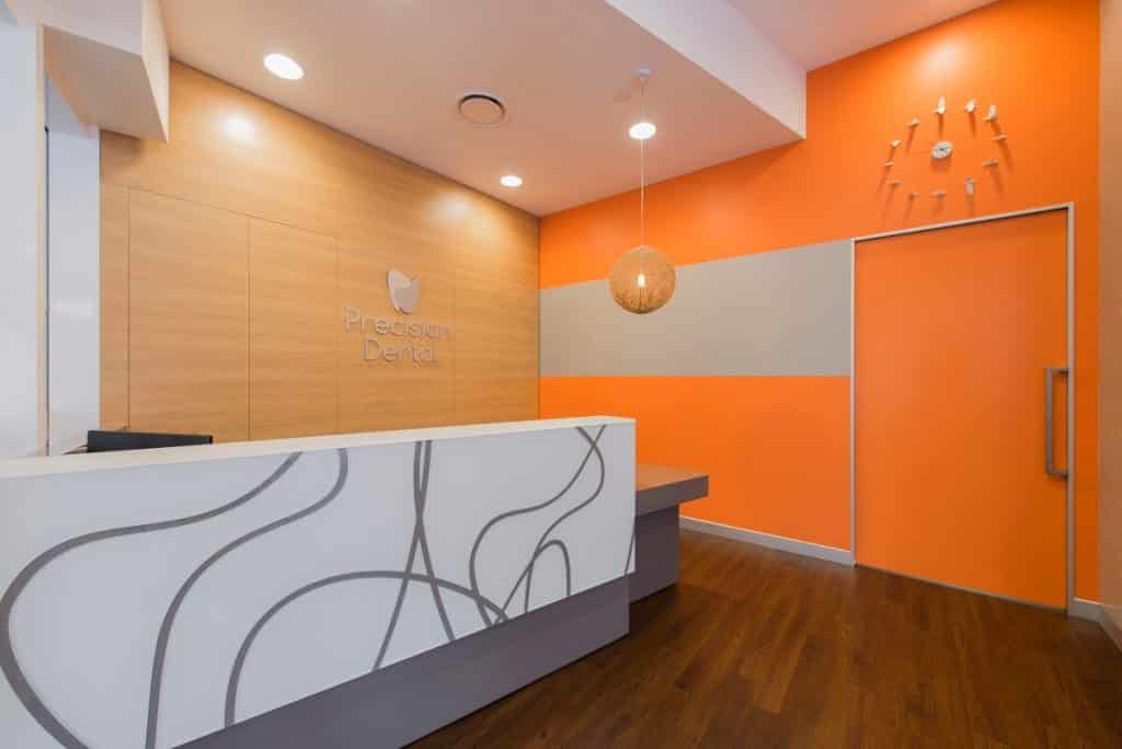 Bright orange paint features in this dental practice